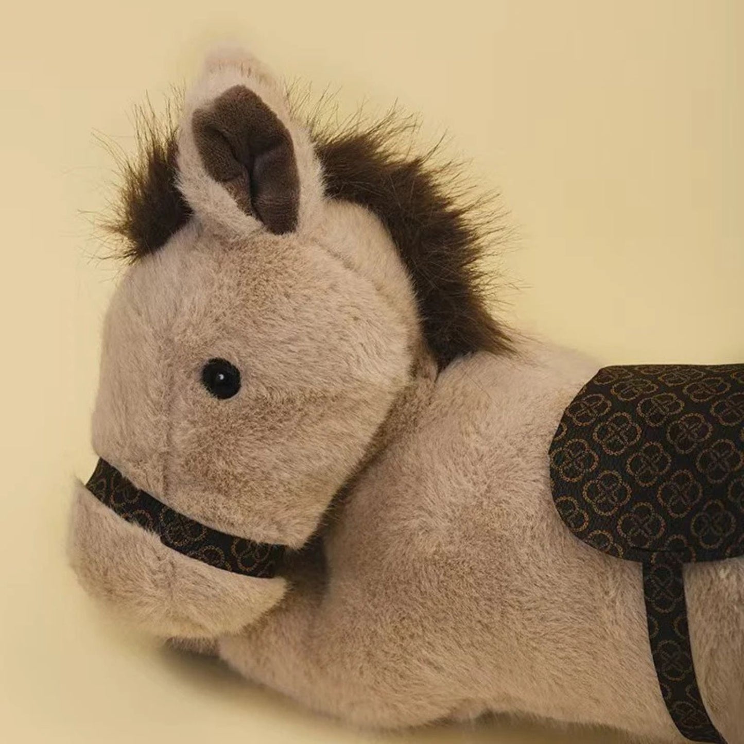 Peluche cheval à monter
